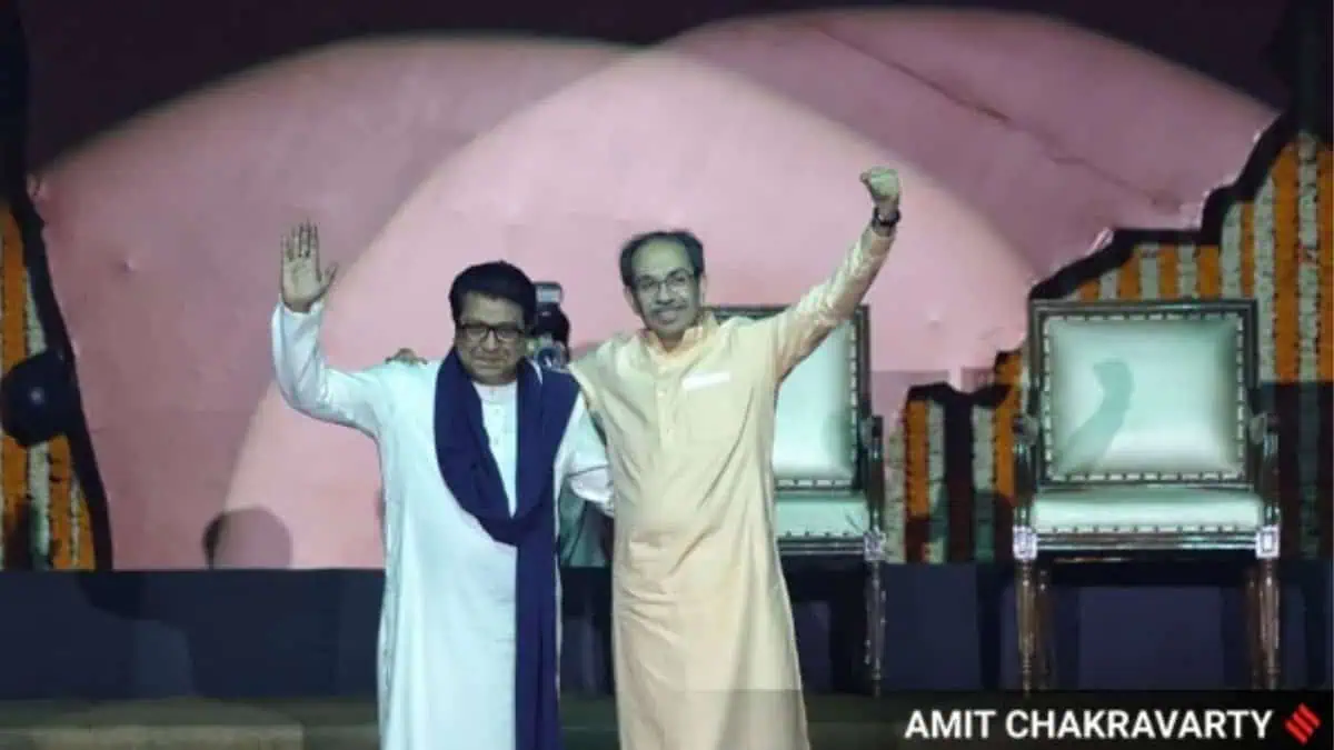 Shiv Sena (UBT) chief Uddhav Thackeray with his cousin and MNS president Raj Thackeray at the NSCI Dome in Worli on Saturday. (Express Photo: Amit Chakravarty)