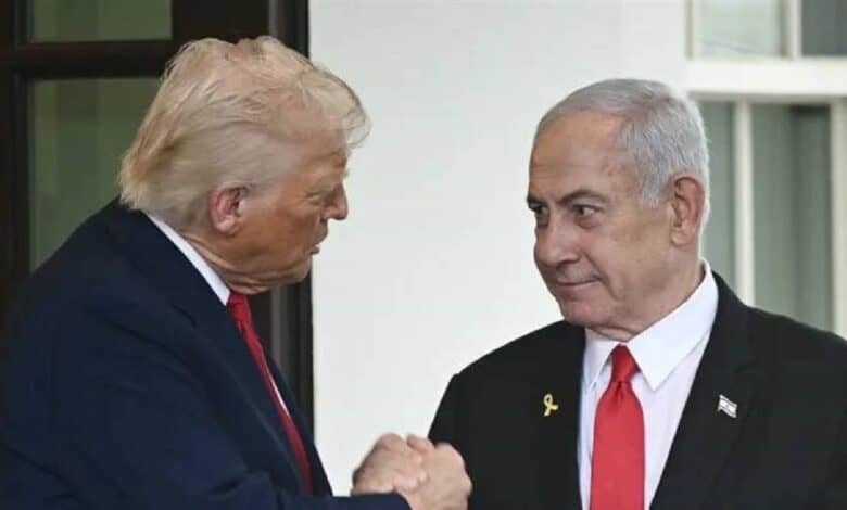 The image of Donald Trump on the left, wearing a dark suit with a red tie, shaking hands with Benjamin Netanyahu on the right, wearing a black suit with a red tie and a small flag pin, standing in front of a white building with large windows.