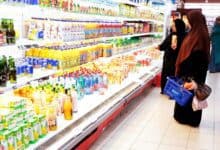Women shop for sweetened beverages at a UAE supermarket.