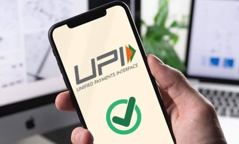 The image of a smartphone screen showing a UPI app with a green checkmark confirming a successful digital payment.