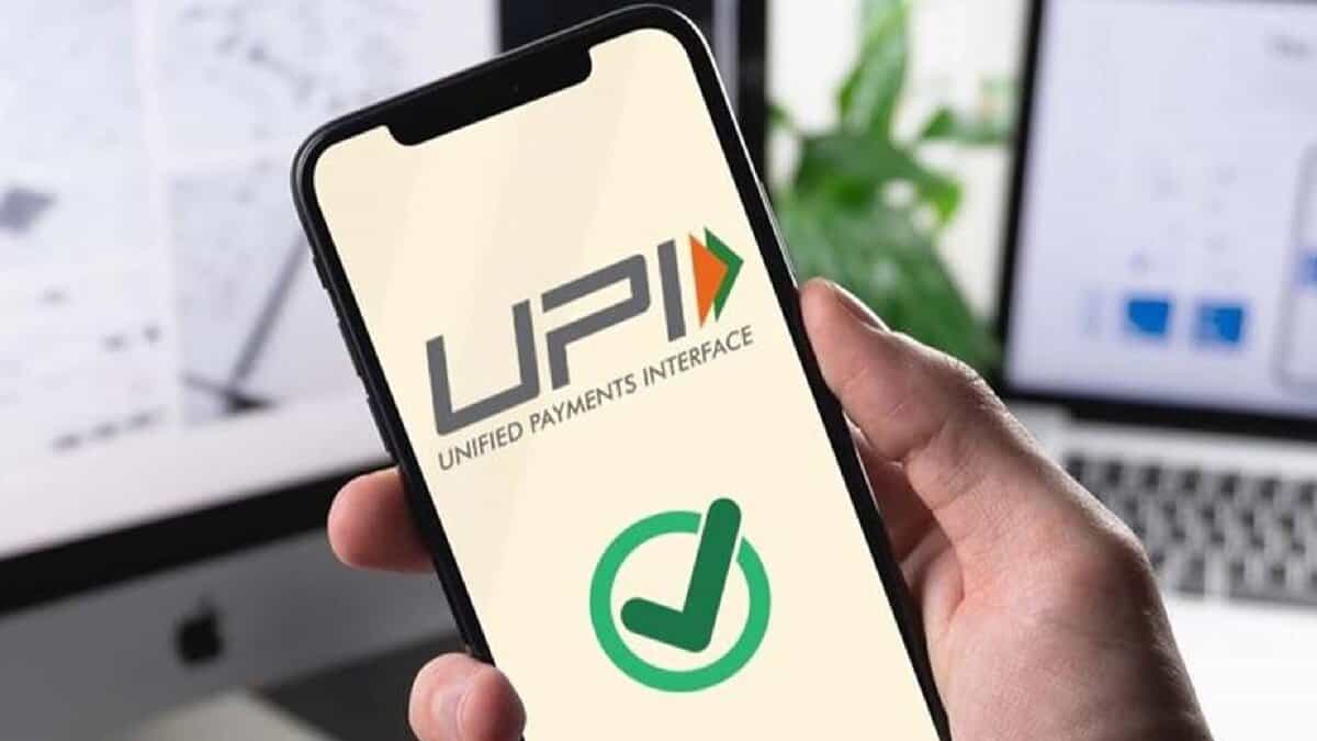 The image of a smartphone screen showing a UPI app with a green checkmark confirming a successful digital payment.