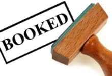 a representational image depicting a person is booked for crime.