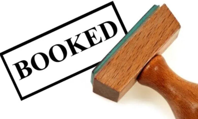 a representational image depicting a person is booked for crime.