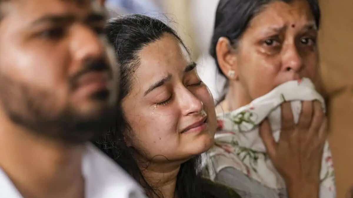 Bereaved family members of one of the passengers who perished in the ill fated London-bound Air India plane crash The flight, a Boeing 787 Dreamliner (AI 171) with 242 people on board, crashed into a medical hostel and its canteen complex in the Meghaninagar area, moments after taking off from the airport. (PTI)