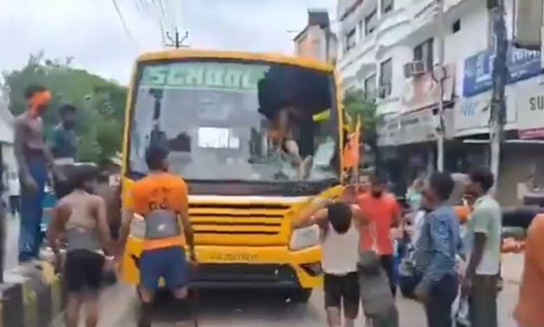 Kanwar Yatra pilgrims break the windshield of a school bus in Meerut