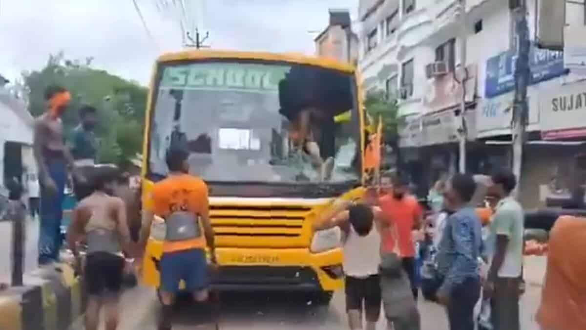 Kanwar Yatra pilgrims break the windshield of a school bus in Meerut