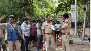 Police inspect the crime scene at Malakpet
