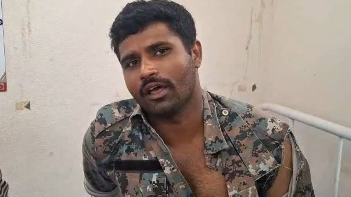 An injured police officer who was attacked by podu Multani farmers in Adilabad on Sunday