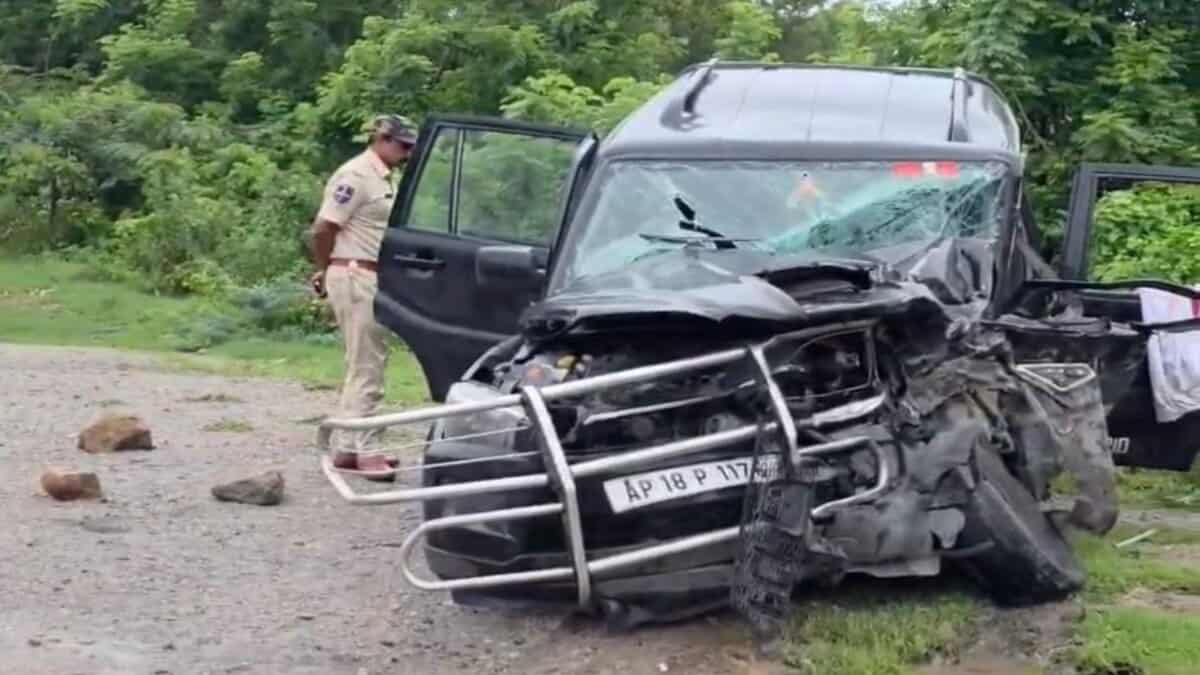 A police man checks the damaged jeep after the accident in Yadadari