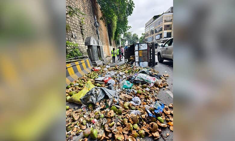 Image of overturned garbage trolley at Lower Tank Bund road in Hyderabad.