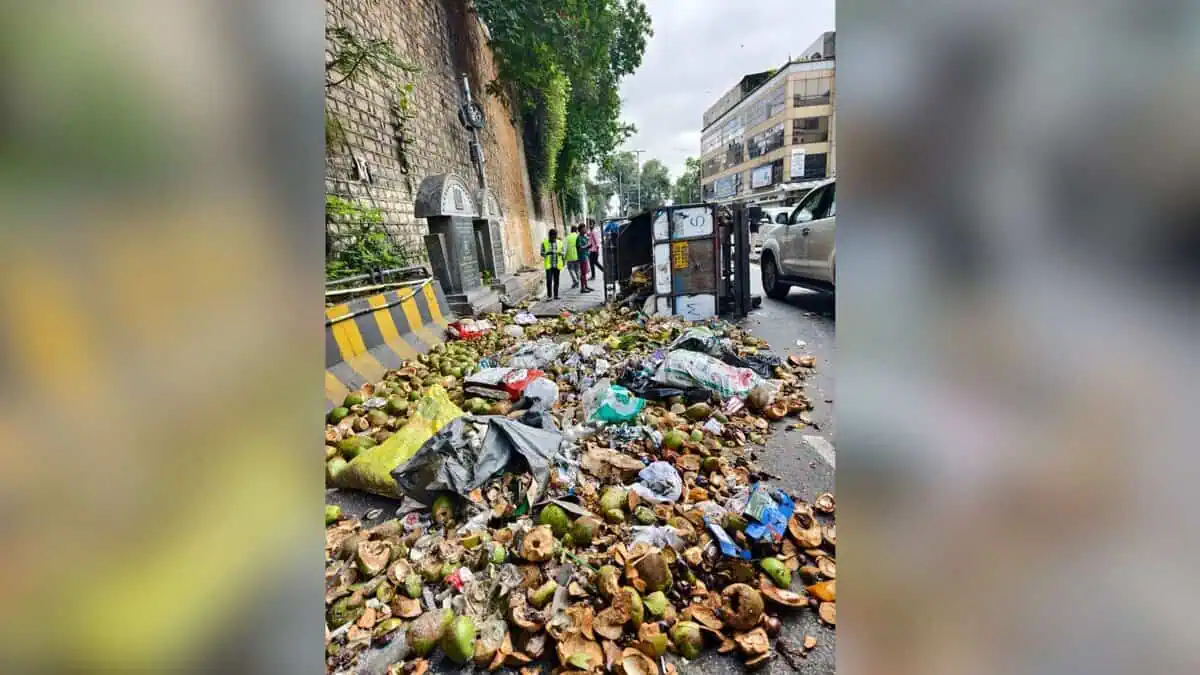 Image of overturned garbage trolley at Lower Tank Bund road in Hyderabad.