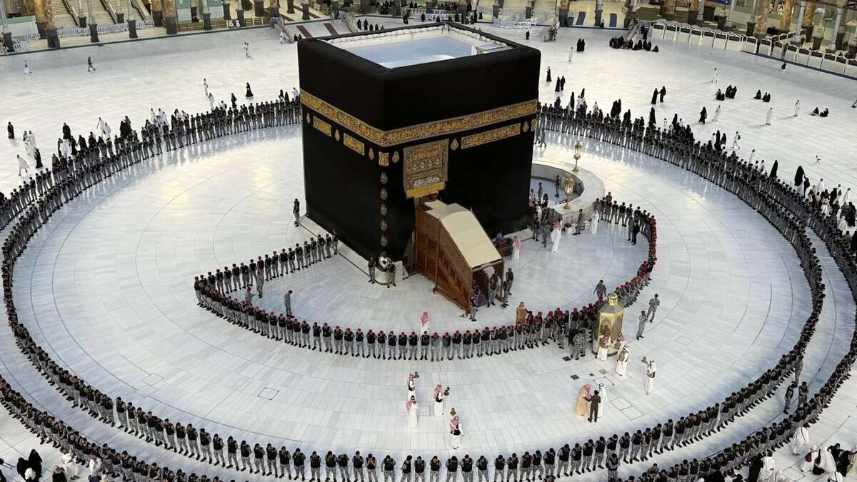 The image of security guards surround the Holy Kaaba in the Grand Mosque, Makkah, Saudi Arabia, during the ceremonial washing on July 10, 2025