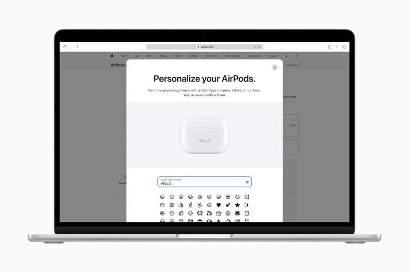 MacBook screen showing Apple’s AirPods engraving interface with the word “HELLO” and emoji options for personalisation.
