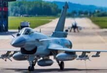 Chinese J-10C fighter jet on runway with another jet in background.