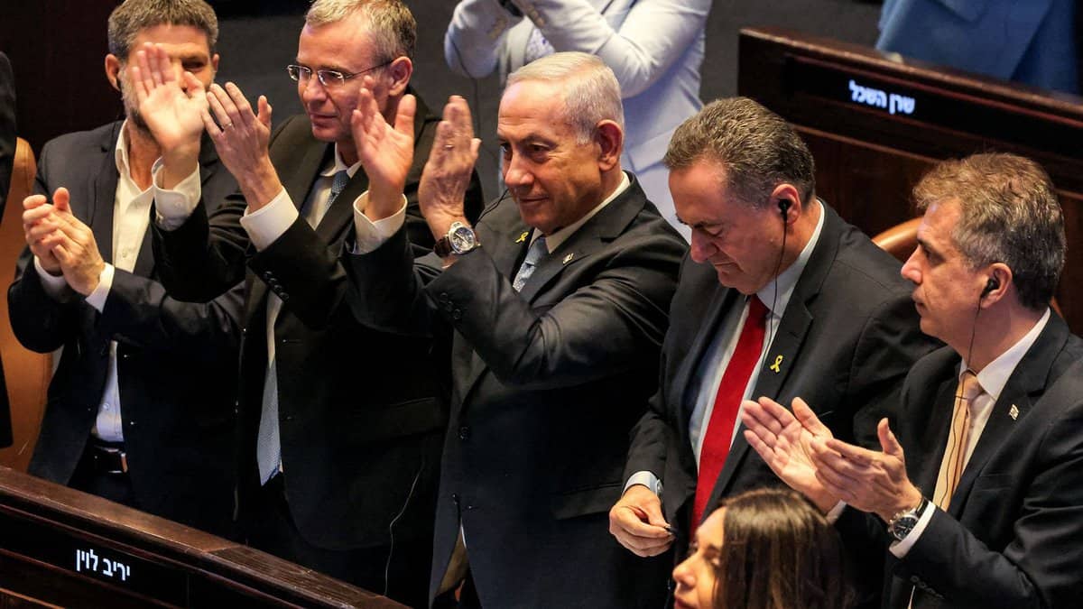Israel's Finance Minister Bezalel Smotrich, Justice Minister Yariv Levin, Prime Minister Benjamin Netanyahu, Defence Minister Israel Katz, and Energy Minister Eli Cohen applaud during a parliamentary session in Jerusalem, June 11, 2025.