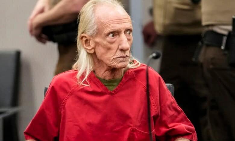 Joseph Czuba, an elderly white man with long white hair, appears in court wearing a red prison uniform.