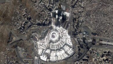 Satellite image of the Grand Mosque in Makkah and its surrounding cityscape, including the Abraj Al Bait Towers.