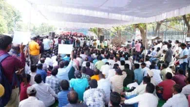 The image shows outsourced employees holding a protest at the Dharna Chowk near Indira Park on Saturday, July 12, 2025.