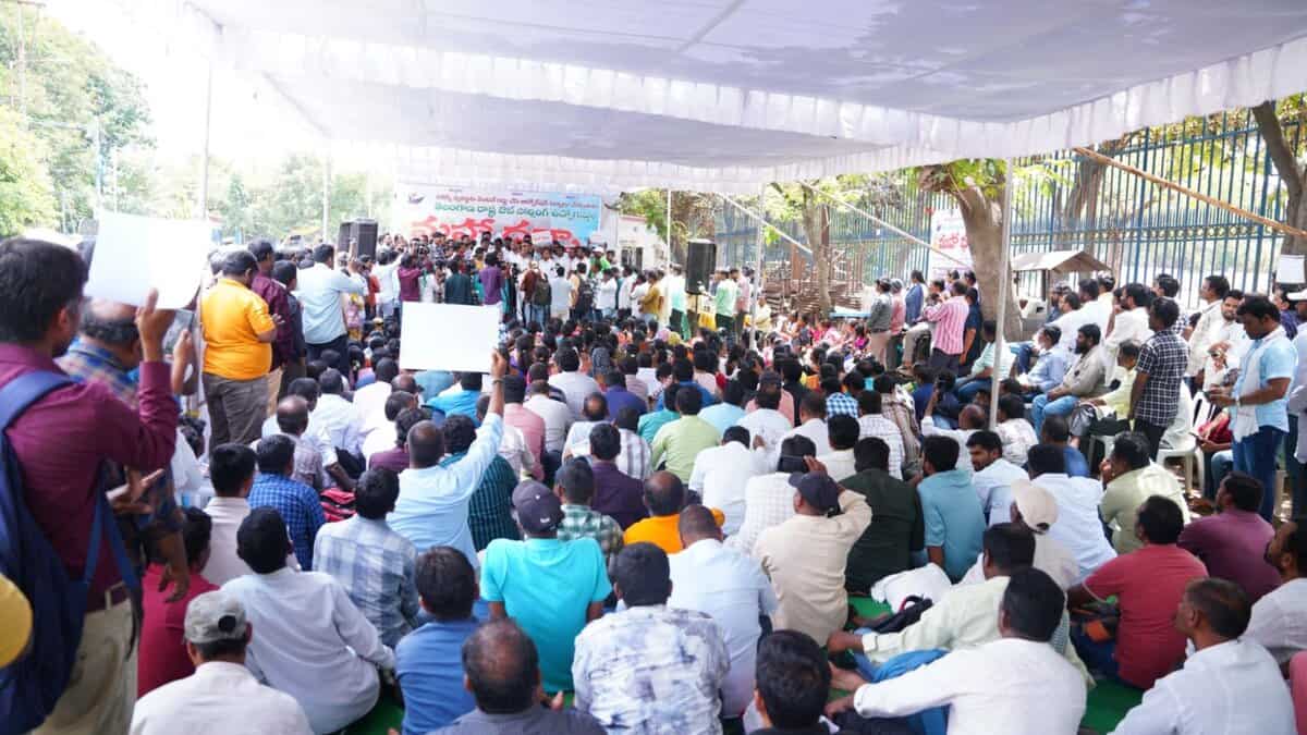 The image shows outsourced employees holding a protest at the Dharna Chowk near Indira Park on Saturday, July 12, 2025.