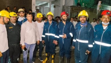 Image of firemen from the Moghalpura fire station after the rescue of residents.