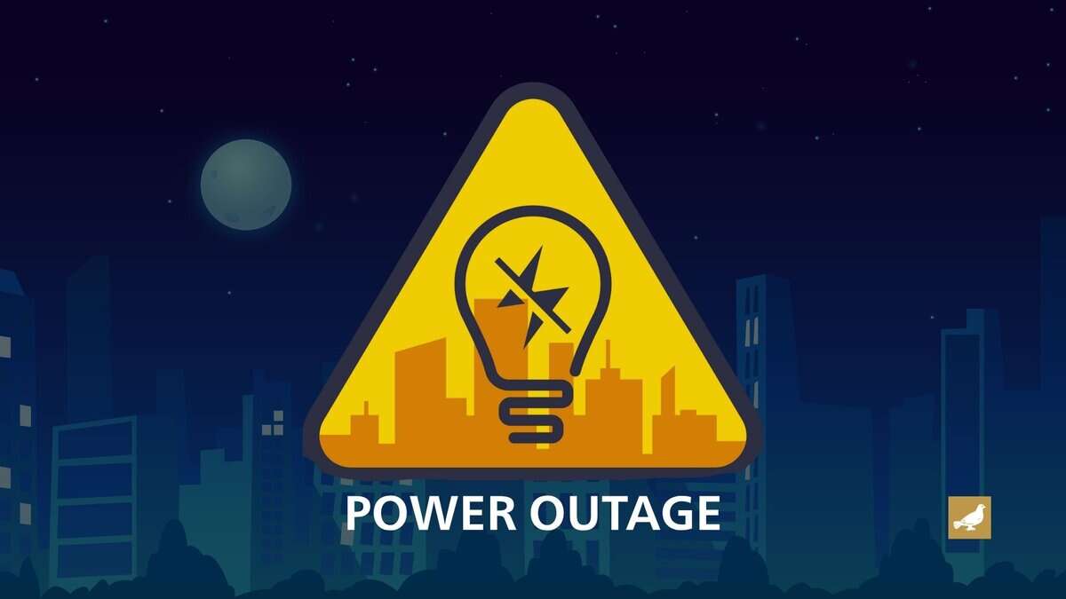 Illustration of a power outage warning, featuring a yellow triangular caution sign with a broken light bulb symbol in front of a city skyline at night.