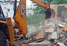 The image shows HYDRAa officials demolishing illegal structures on a nala between Pariki Cheruvu and Kukatpally in Medchal-Malkajgiri district on Monday, August 18, 2025.
