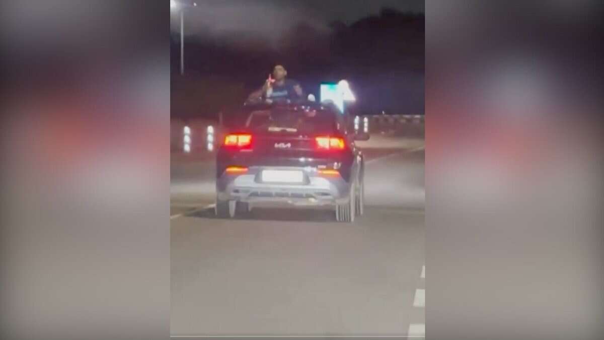 Video: Man filmed drinking, smoking from car sunroof on Hyderabad airport road