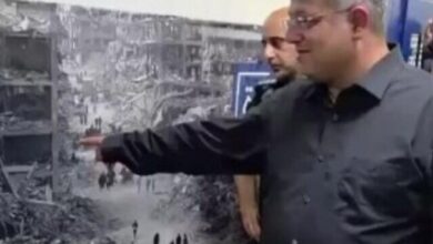 Israeli National Security Minister Itamar Ben-Gvir points at a large photo of Gaza destruction displayed for Palestinian prisoners, August 20.