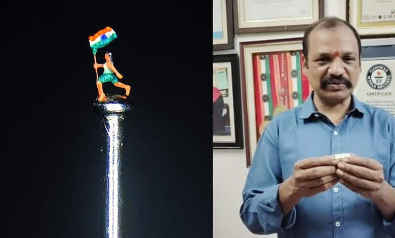 The image shows micro-artist Dr Gurram Dayakar with his new miniature statue carved on a needle.