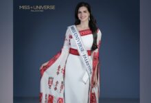Nadeen Ayoub wearing a traditional Palestinian embroidered dress with the Miss Universe Palestine sash.