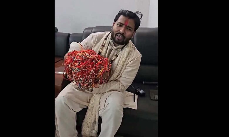Khan Sir shows his hand full of Rakhis tied by students