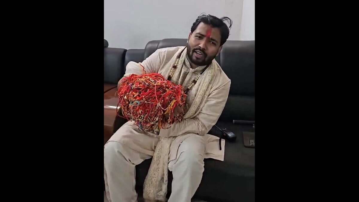 Khan Sir shows his hand full of Rakhis tied by students