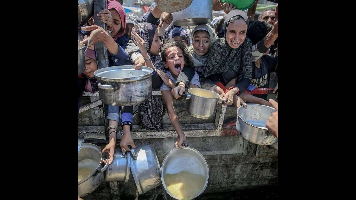 People wait for food aid in Gaza