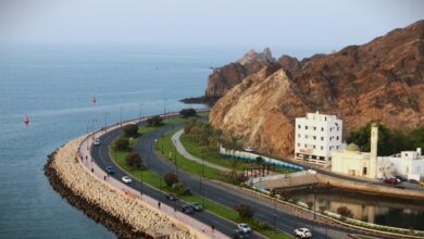 Curved coastal road by the sea in Muscat, Oman.