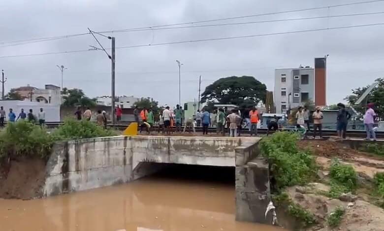 People stranded at the the railway under bridge in Mahabubnagar