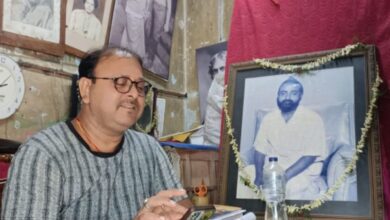 Shantanu Mukherjee with the portrait of his grandfather, Gopal Patha