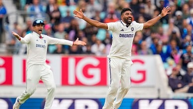 India's Mohammed Siraj and captain Shubman Gill celebrate the wicket of Englnd's Jamie Overton during the fifth day of the fifth Test match between India and England at The Oval cricket ground in London on Monday.