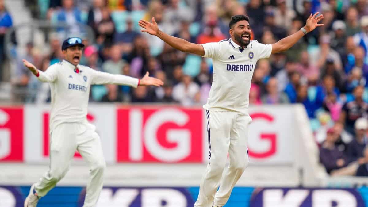 India's Mohammed Siraj and captain Shubman Gill celebrate the wicket of Englnd's Jamie Overton during the fifth day of the fifth Test match between India and England at The Oval cricket ground in London on Monday.