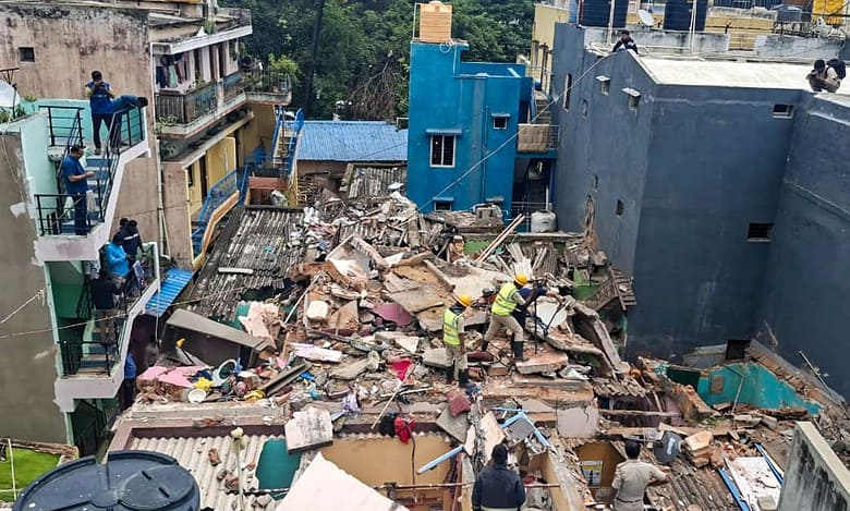 Rescue operation underway following a cylinder blast in Bengaluru on Friday.(PTI Photo)