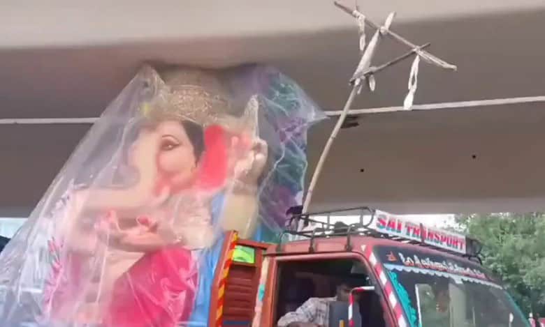 A Ganesha idol stuck under the Punjagutta Flyover, causing massive traffic