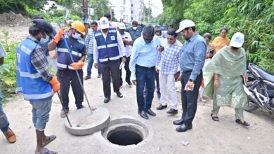 HMWSSB MD Ashok Reddy inspects a manhole in Kavuri Hills on Monday