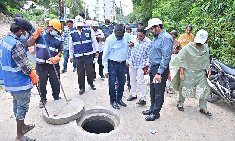 HMWSSB MD Ashok Reddy inspects a manhole in Kavuri Hills on Monday