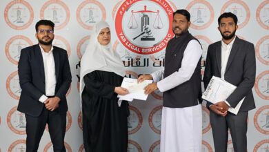 Rehmathbi Mamad Sali receives the compensation for the accident