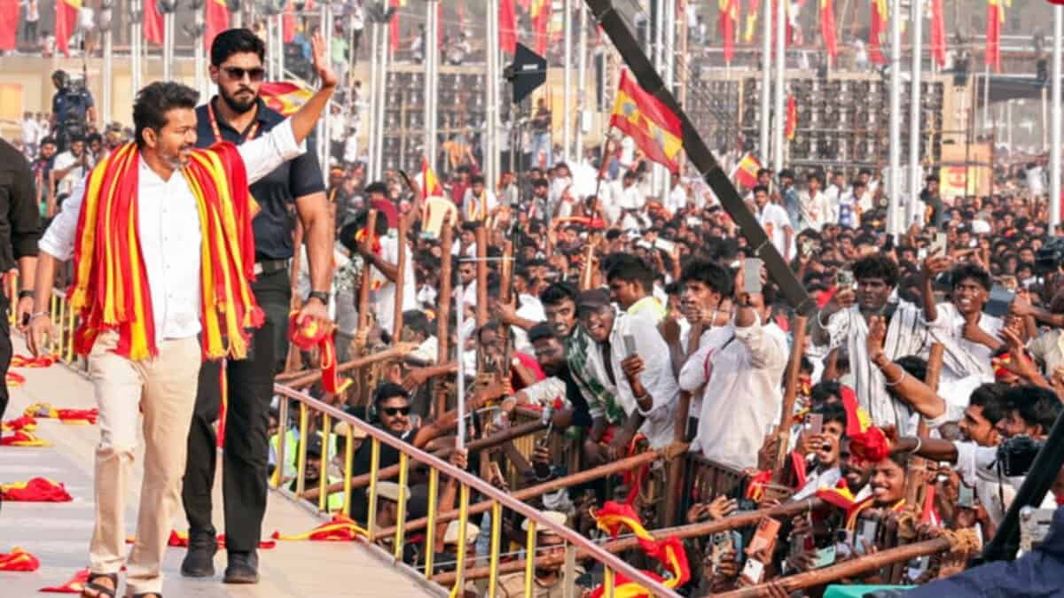 Tamilaga Vettri Kazhagam (TVK) chief and actor Vijay greets his supporters at a massive rally in Madurai