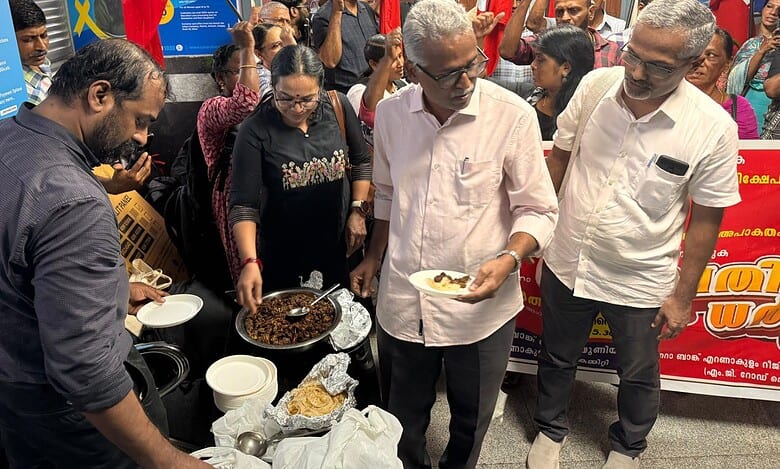Staff staged a ‘beef festival’ outside the office of a Canara Bank branch in Kochi