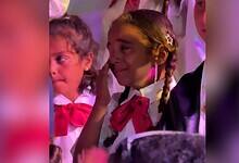 The image of tearful Palestinian children in school uniforms at a graduation ceremony in Gaza.
