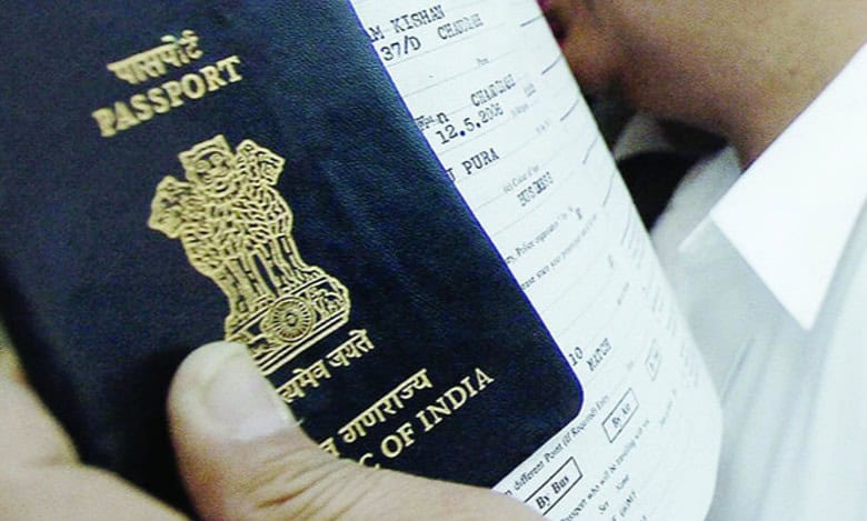An Indian passport held alongside travel documents.