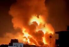 Flames and smoke rise during overnight bombing in Jabalia, northern Gaza.