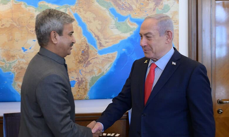 Israeli Prime Minister Benjamin Netanyahu shakes hands with India’s Ambassador to Israel, J P Singh, during a meeting in Jerusalem.