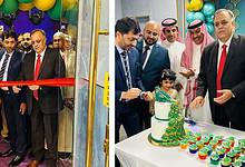 Dr Suhel Khan cuts ribbon and cake at Peacock Restaurant’s Riyadh opening with Indian and Saudi guests.
